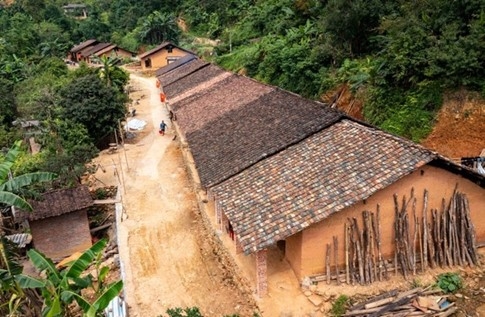 Unique earthen-walled houses with yin-yang tile roofs of the Dao Tien ethnic group