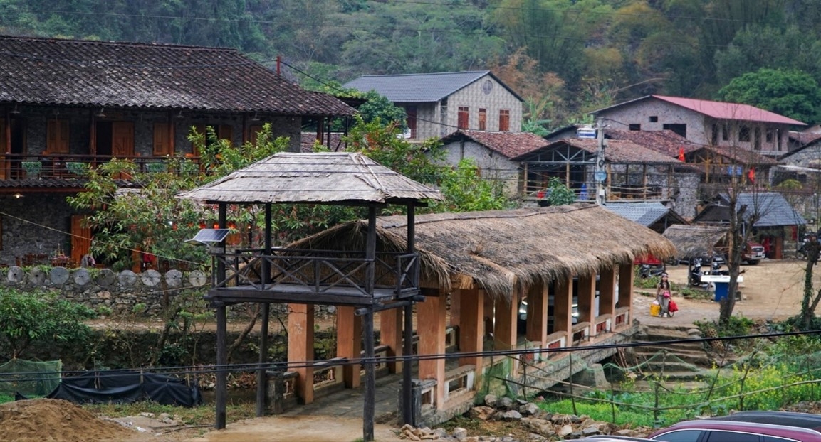 The ancient, tranquil charm of Khuoi Ky is enhanced by the wooden bridge leading into the village