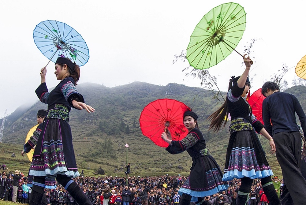Mong girls performing traditional dances at the Gau Tao festival