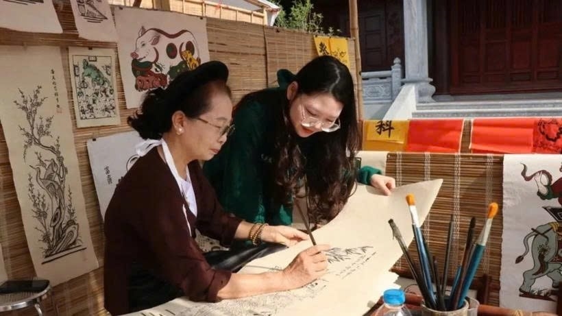 Visitors learn about the process of making Dong Ho folk paintings