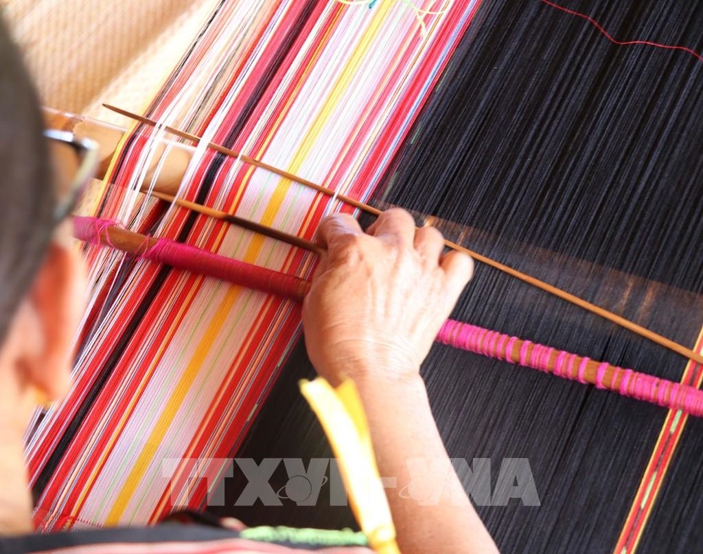 Gia-rai women work meticulously at rudimentary looms to create unique brocade fabrics