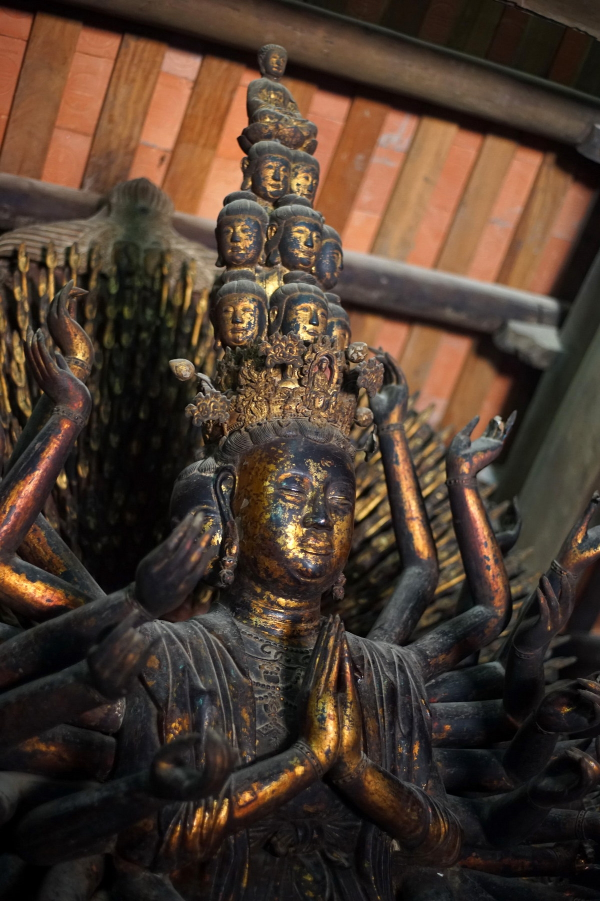 : Statue of Avalokiteshvara (Bodhisattva of compassion) with a thousand hands and a thousand eyes at But Thap pagoda 