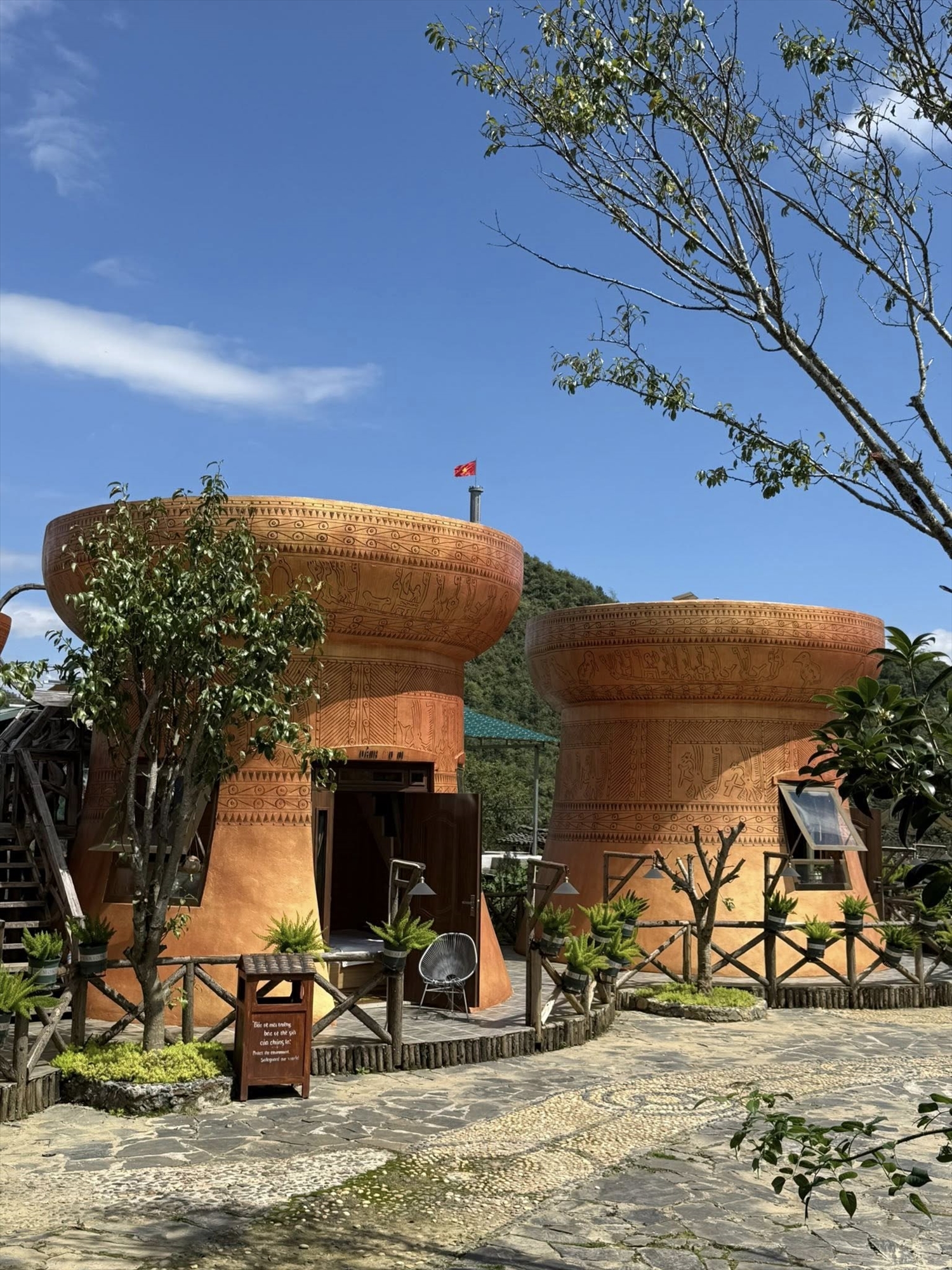 Danh House features bungalows designed to resemble a pair of bronze drums.